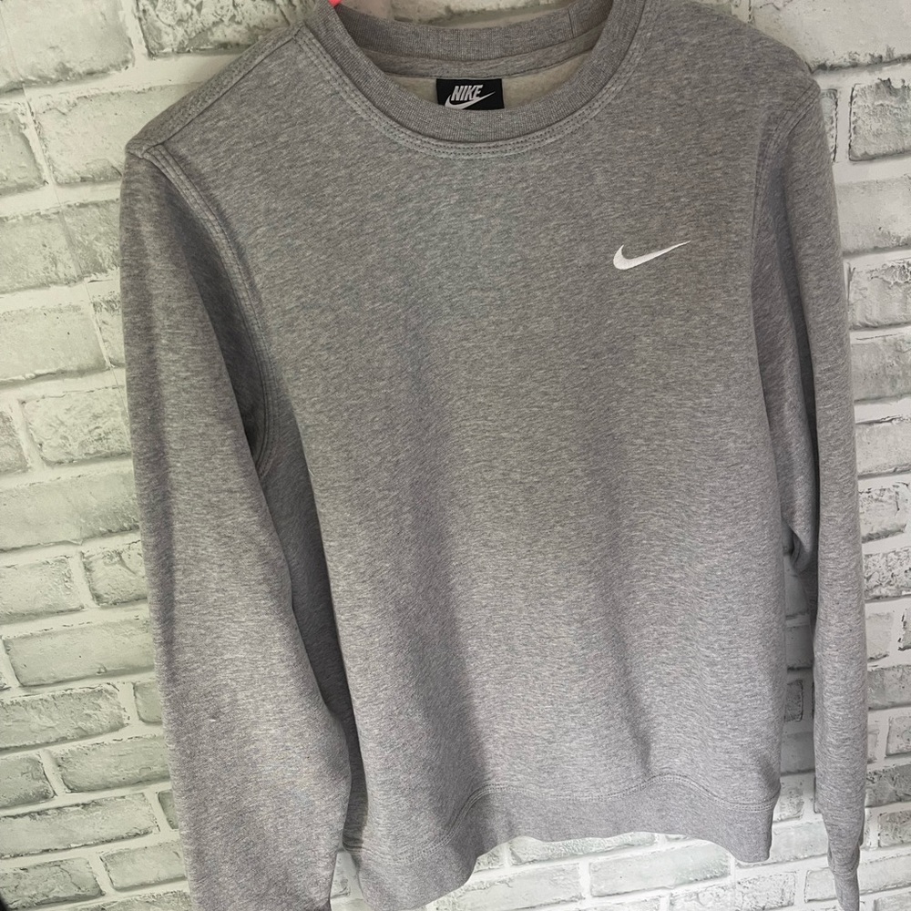 This is a grey Nike crewneck and has never been worn before